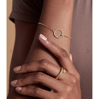 Gold bracelet shown on model