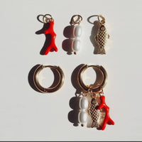 Gold plated hoop water proof fish shaped earrings with orange coral and pearls. Each charm can be worn together as shown or separately on the hoop