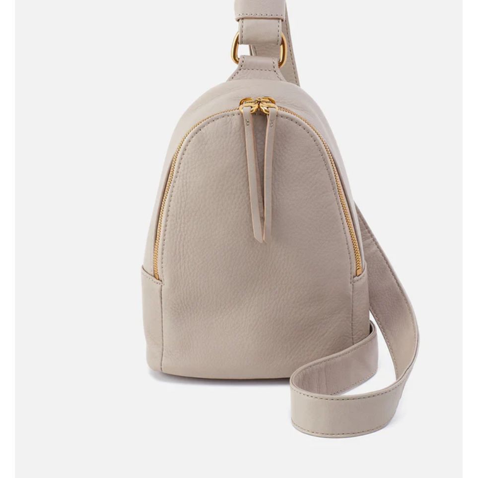 Our iconic sling bag that’s crafted for your ever-changing life.  Shown in taupe