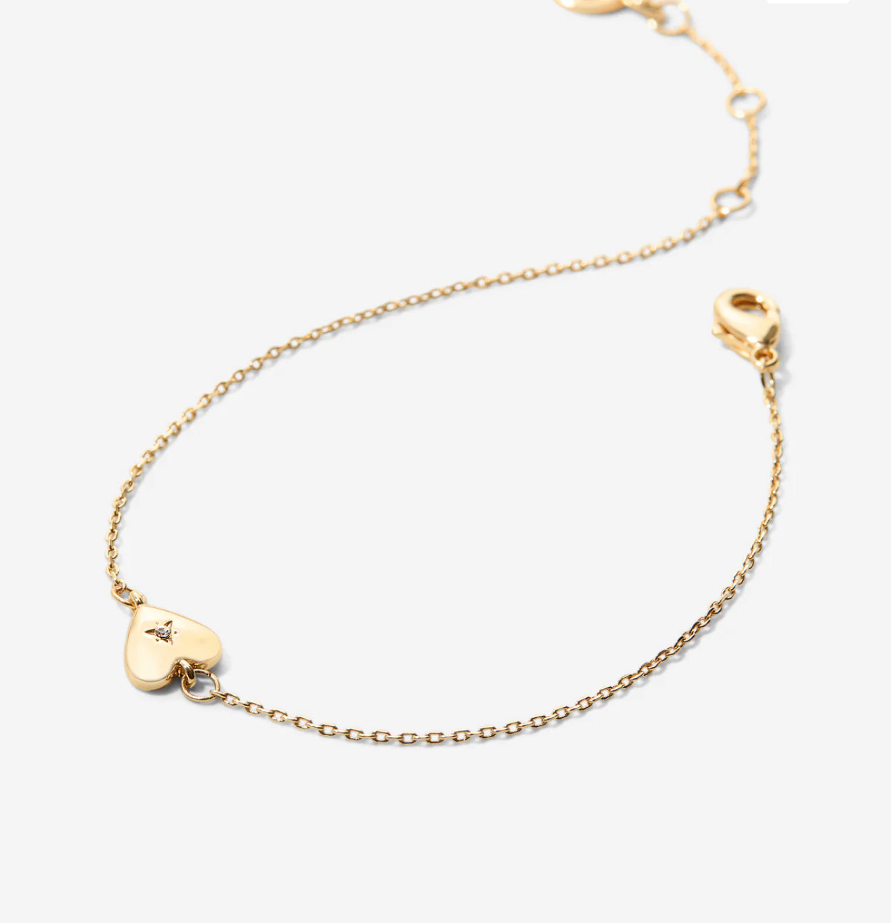Dainty gold chain with small heart and a cz in center