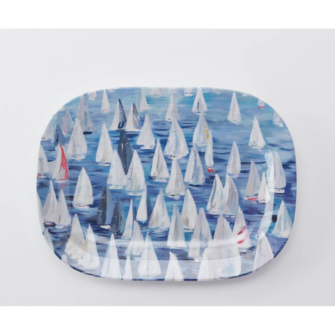 Set sail and a pop of color to your coastal table with the Race Day collection.   This melamine collection is great for indoor or outdoor entertaining in your coastal home.  This large platter has a blue background with sailboats all over.