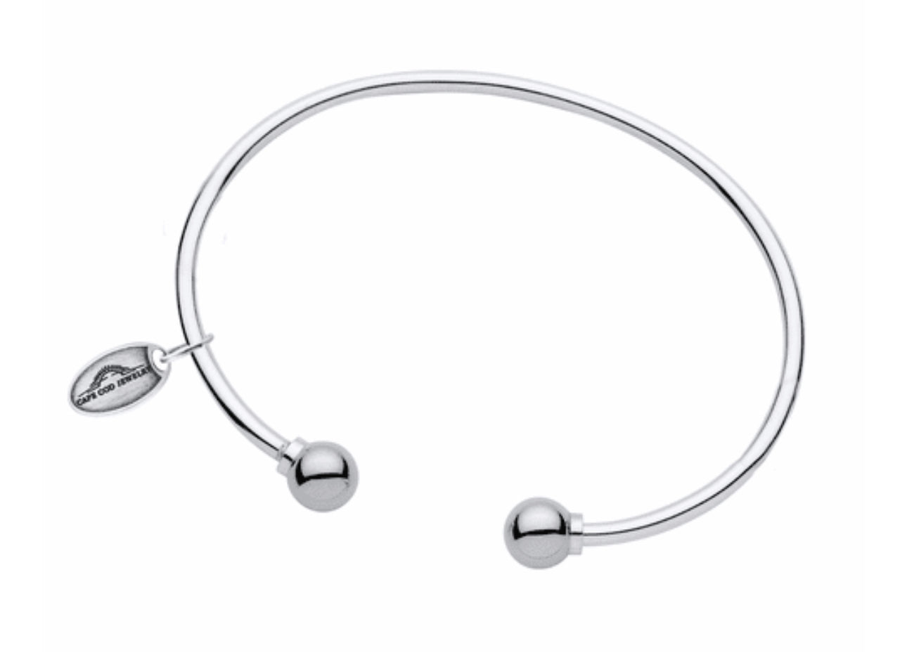 LeStage's genuine Cape Cod Bracelet, with its simple but stylish design is a favorite for all ages!
A unique spin on the classic look -- this cuff features two sterling silver or gold balls on each end.  This bracelet is great to wear alone or add to your Cape Cod Jewelry collection. 
Sterling Silver shown
Made in USA