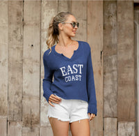 East Coast V Sweater – Cool, Cropped & Coastal blue with white lettering 
East Coast lovers, this one’s for you. The East Coast V by Wooden Ships is the ultimate warm-weather sweater, featuring bold knit-in lettering and a breezy, lightweight feel. Made with Wooden Ships’ signature cotton blend yarn, this cropped, boxy silhouette