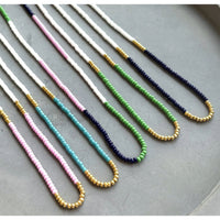 Bright, bold, and full of personality—these multicolor seed bead necklaces are made to stand out. With vivid green, turquoise, and deep navy tones, these handmade pieces bring a splash of joy to any outfit. Whether you're heading to a music festival, beach day, or brunch with friends, this design adds a playful pop of color that totally vibes.
 
Details:
•Vibrant green, lilac, turquoise, and navy seed beads
•Lightweight and comfortable
•Gold filled spring ring clasp 
 
Each piece is handmade, giving it a o