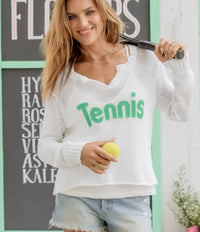 Effortlessly chic and refreshingly lightweight, this white V-neck sweater features the word “Tennis” in green knit directly into the front—perfect for sporty days. Crafted from breathable cotton, it has a relaxed silhouette with a flattering neckline that drapes beautifully, finished with ribbed cuffs and side slits.
 
SIZE	CHEST WIDTH (CM)	LENGTH (CM)
X/S	2-4	58.50	54.75
S/M	6-8	60.00	57.00
M/L	10-12	62.50	59.25