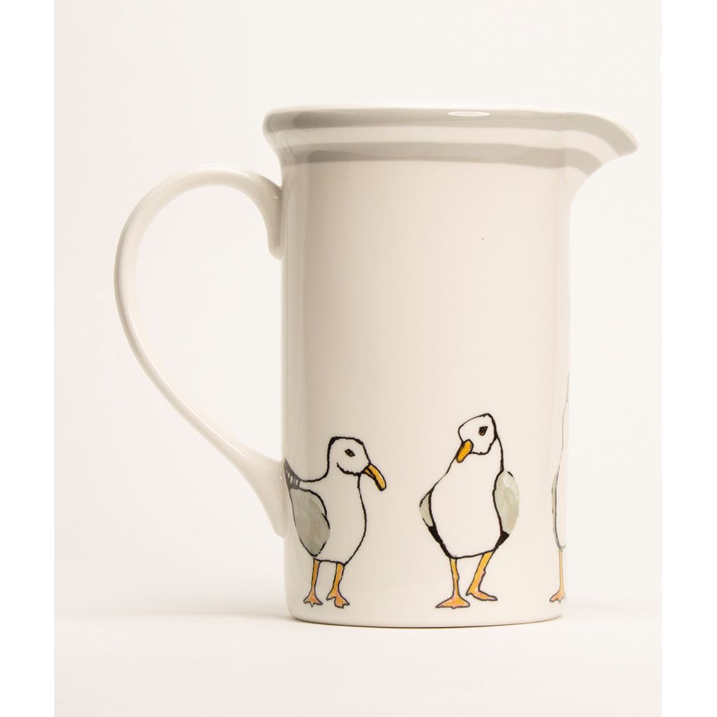 Accentuate your home decor with a beautifully crafted pitcher, seamlessly blending form and function to not only serve beverages but also serve as an eye-catching centerpiece, enhancing the aesthetic appeal of your space.
8″ spouted Earthenware pottery pitcher with handle.
Dishwasher and Microwave safe
48 fluid oz., 5″ in diameter