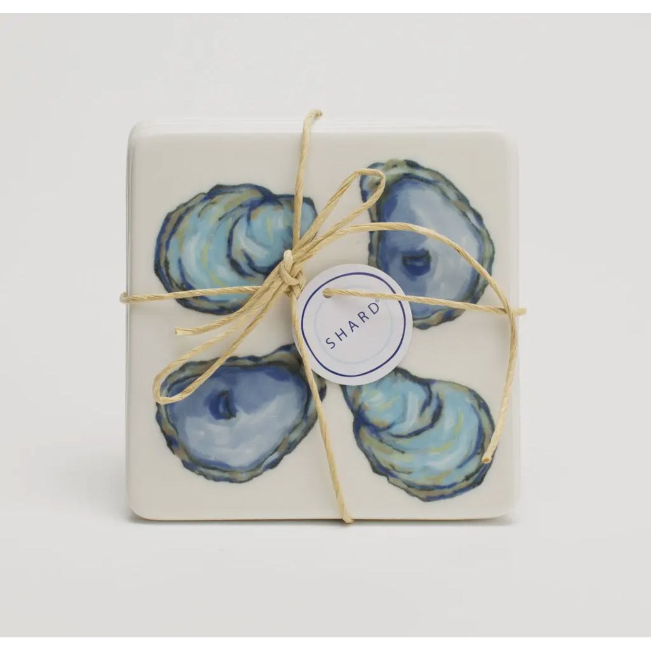 Coaster -
Sold Separate Earthenware Coaster Set with Oysters Design
Each set comes raffia wrapped ready to give as a hostess gift or put on display.
Rubber Cushion Stoppers to Prevent Slipping or Tabletop Damage