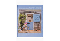 Perfect for puzzle and fine art photography enthusiasts alike, Gray Malin Nantucket 1000 Piece Book Box Puzzle features "Old North Wharf Cottage, Nantucket" from Gray’s best-selling collection, 1000 pieces