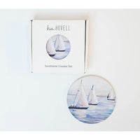 3 sailboats on the water on the coasters. 
Made to keep your tables scratch-and-moisture-free, our sandstone coasters have a cork backing, so you can use them on any surface.
Kim Hovell Original Artwork: Ebb and Flow
Diameter: 4.25"
Thickness: 0.25"
Made of sandstone with a cork pad backing
Not dishwasher safe