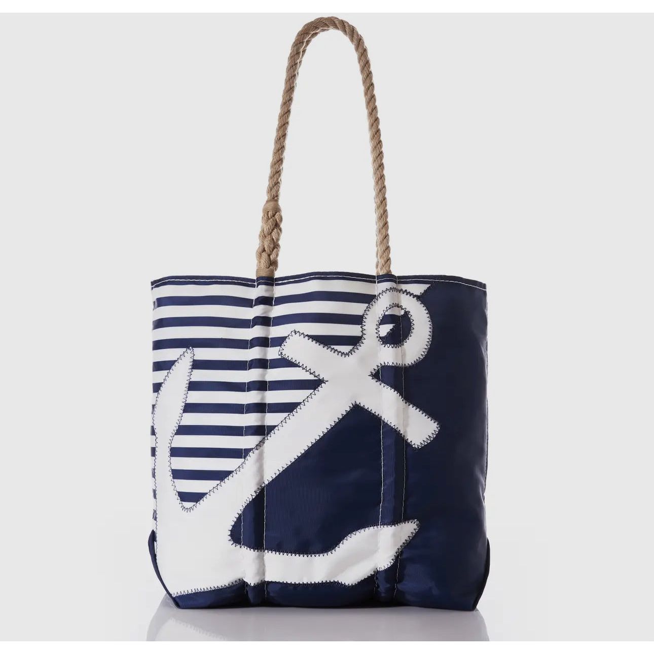 Anchor sail bag shown 
Sailboats have been a source of inspiration since the first ones set sail to the ends of the earth. While the days of shipping by sailing vessel are largely over, the exploration continues with a variety of original sails that have become this unique Vintage Black 197 Medium Tote. Featuring hand-spliced rope handles and original sail insignia that has seen the ocean, these totes are crafted by hand right here in Maine. Finished with an interior hanging pocket and metal clasp closure,