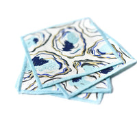 Our darling set of 4 cocktail napkins with hand painted features hand painted lend a sophisticated air and coastal component to any home. 
These soft linen napkins are artfully destined to add just the right touch to your next gathering.