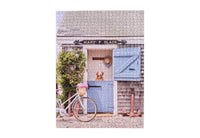 Showing completed puzzle
erfect for puzzle and fine art photography enthusiasts alike, Gray Malin Nantucket 1000 Piece Book Box Puzzle features "Old North Wharf Cottage, Nantucket" from Gray’s best-selling collection, 1000 pieces