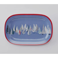 Set sail and a pop of color to your coastal table with the Race Day collection.   This melamine collection is great for indoor or outdoor entertaining in your coastal home.  This platter has a red rim pop with the interior being blue decorated with sailboats.