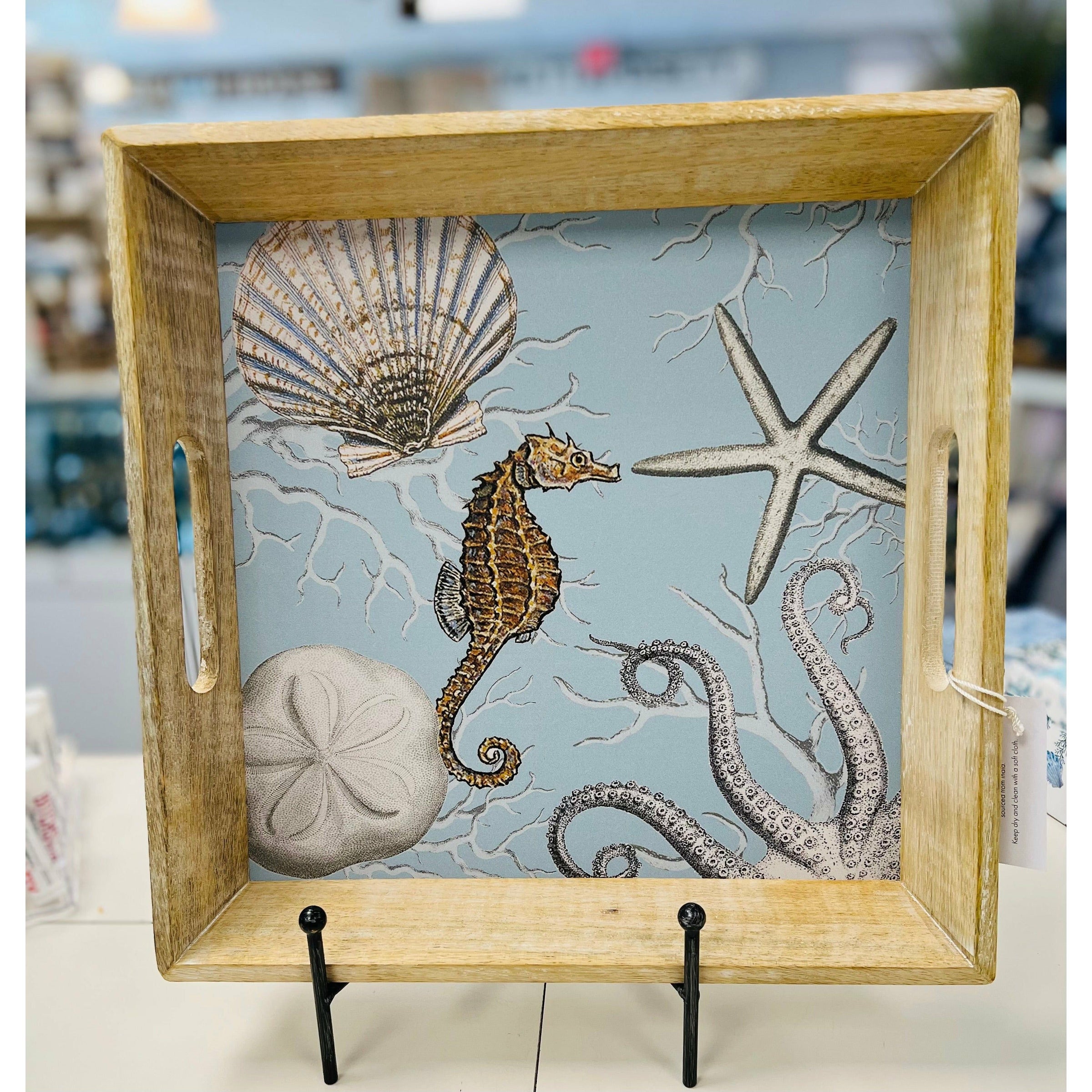 Hand in USA seahorse and small tray. Light blue with wood