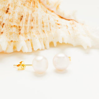 Large Pearl Stud Earrings on prop