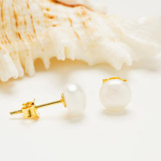 Small Pearl Stud Earrings on prop