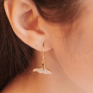 Whale Tail Earrings on model