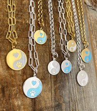 Forever in our hearts Lola charms shown on necklaces Sterling silver and gold 