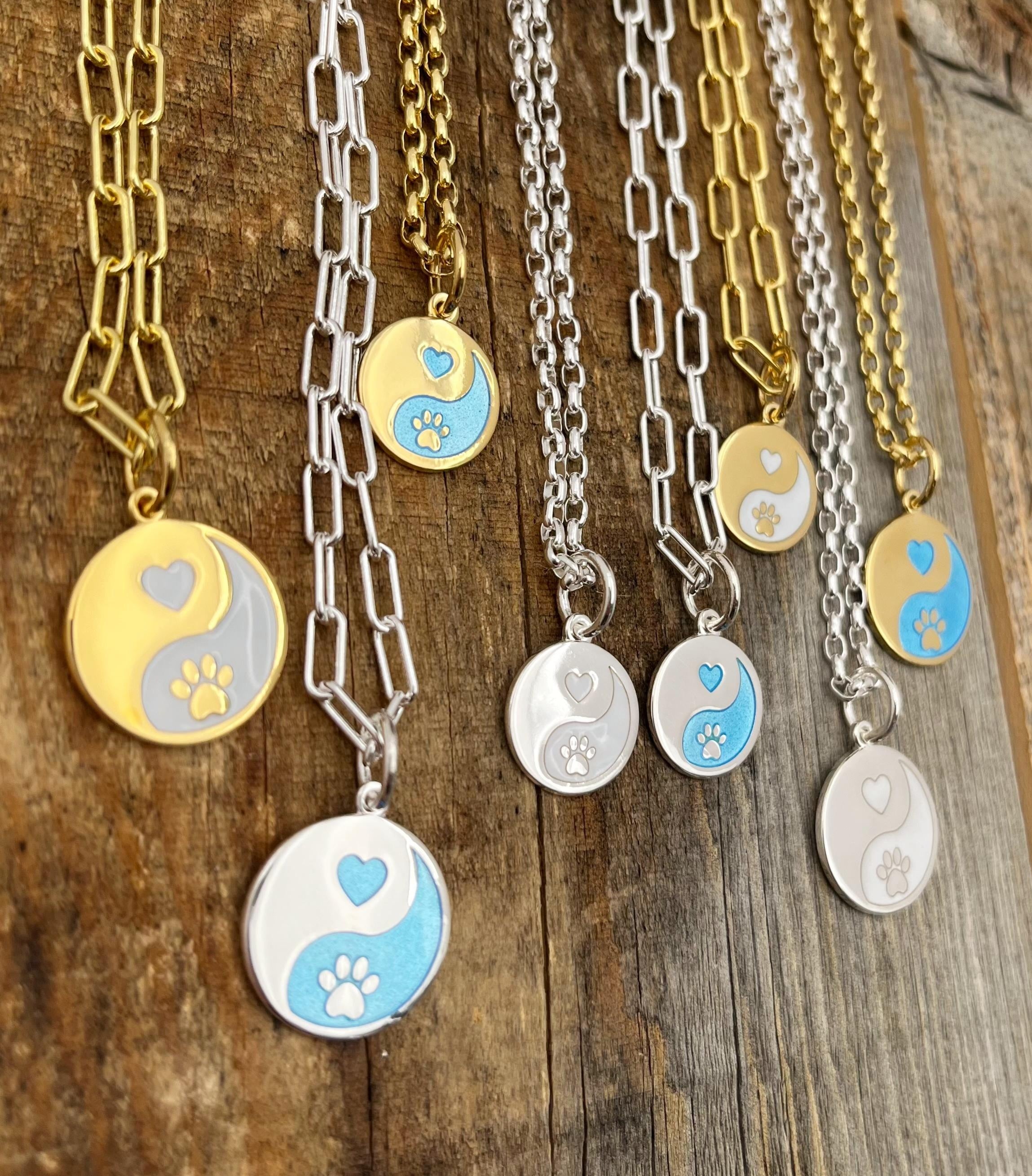 Forever in our hearts Lola charms shown on necklaces Sterling silver and gold 