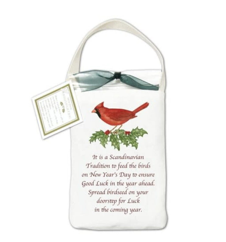Quote reads: "It is a Scandinavian Tradition to feed the birds on New Year’s Day to ensure Good Luck in the year ahead. Spread birdseed on your doorstep for Luck in the coming year."

Kit: Includes a 3 ½" x 5 ¼" cotton tote, clear cello bag filled with birdseed and ribbon.

Cardinal 