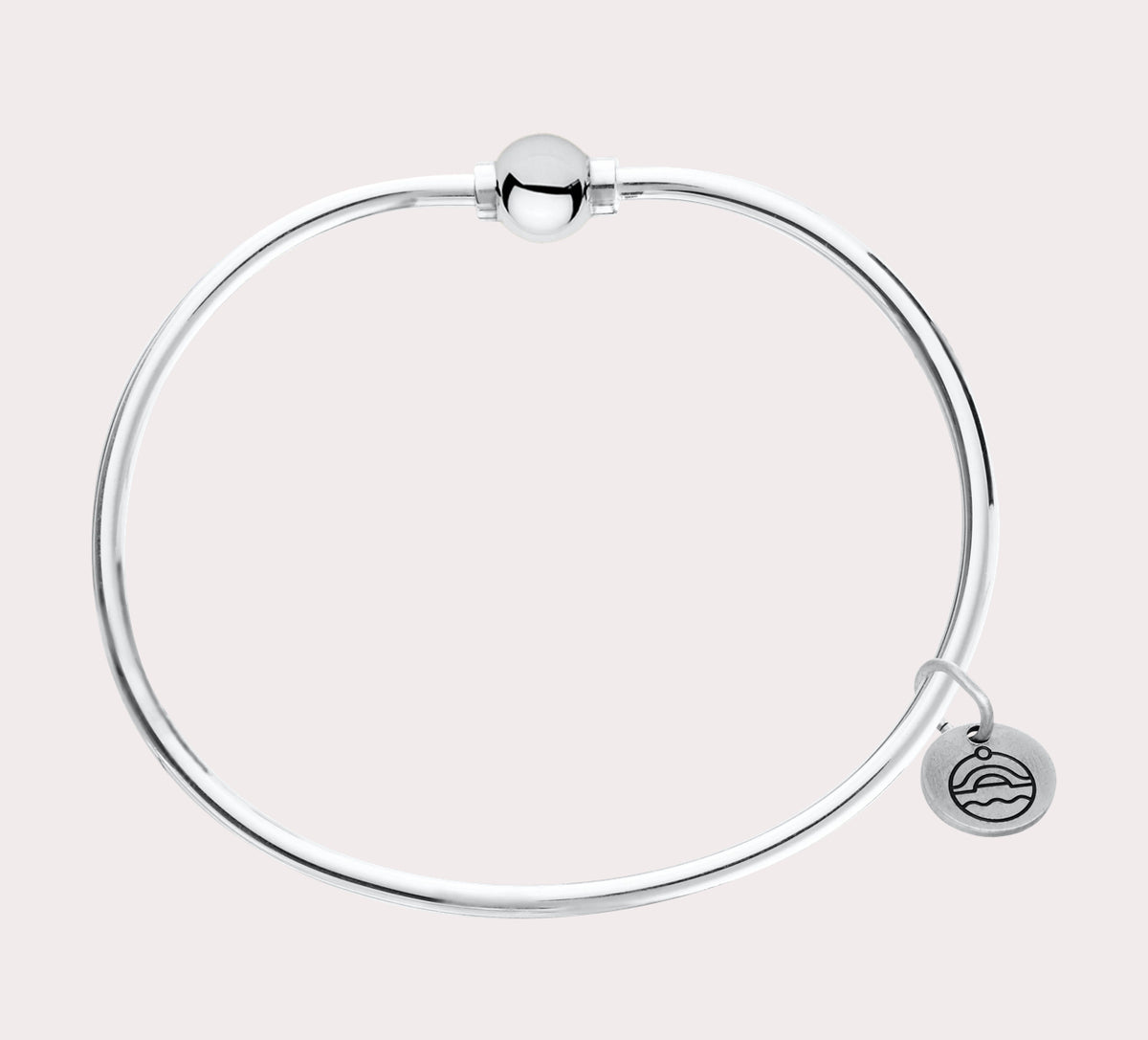 The original design of the Cape Cod Jewelry®️ line, with a sterling silver bangle and single ball available in sterling silver, 14k yellow gold.  Silver shown 