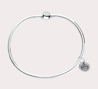 The original design of the Cape Cod Jewelry®️ line, with a sterling silver bangle and single ball available in sterling silver, 14k yellow gold.  Silver shown 