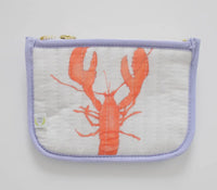 Red lobster shown on light background with purple pipping on edges 