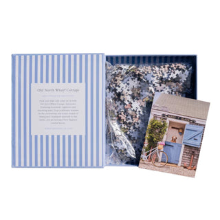 Showing puzzle book open with pieces

erfect for puzzle and fine art photography enthusiasts alike, Gray Malin Nantucket 1000 Piece Book Box Puzzle features "Old North Wharf Cottage, Nantucket" from Gray’s best-selling collection, 1000 pieces 