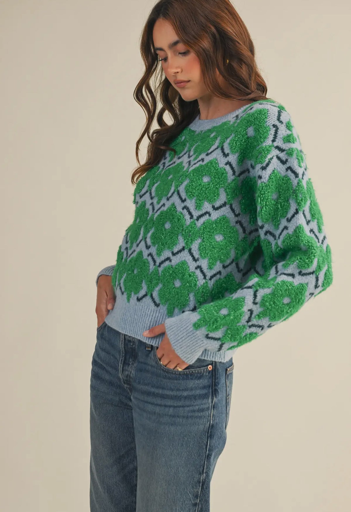 This fuzzy textured green and blue floral sweater has a relaxed fit rubbed collar, neckline, cuffs  and hem. 
The warm blue and vibrant green flowers make add the perfect amount of color and fun to fall and winter. 