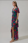 Keep it cute and pretty in the Kaeli Floral Amabel Tiered Maxi Dress. This floral-patterned maxi features a deep v-neck, short sleeves, and a tiered design with a smocked back for a flattering silhouette. Style it with block heels and a delicate clutch for a polished finish.

- Maxi
- Floral
- Deep V-neck
- Tiered
- Color: Magenta Blue Green

Size + Fit
- Model is 5'9" and wearing size XS
- Measurements taken from size S
- Chest: 19"
- Length: 58 1/4"

Fabric

Self: 100% Polyester, Lining: 97% Polyester 3% 