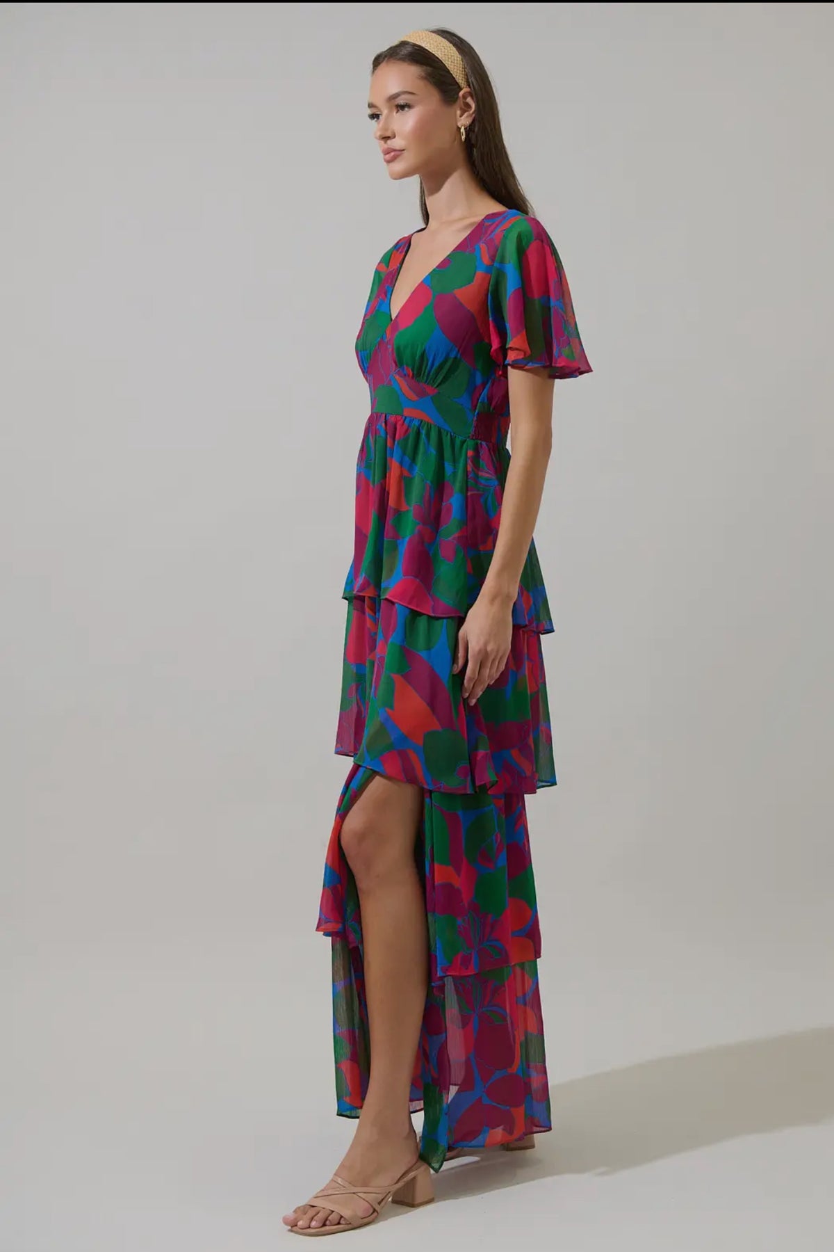 Keep it cute and pretty in the Kaeli Floral Amabel Tiered Maxi Dress. This floral-patterned maxi features a deep v-neck, short sleeves, and a tiered design with a smocked back for a flattering silhouette. Style it with block heels and a delicate clutch for a polished finish.

- Maxi
- Floral
- Deep V-neck
- Tiered
- Color: Magenta Blue Green

Size + Fit
- Model is 5'9" and wearing size XS
- Measurements taken from size S
- Chest: 19"
- Length: 58 1/4"

Fabric

Self: 100% Polyester, Lining: 97% Polyester 3% 