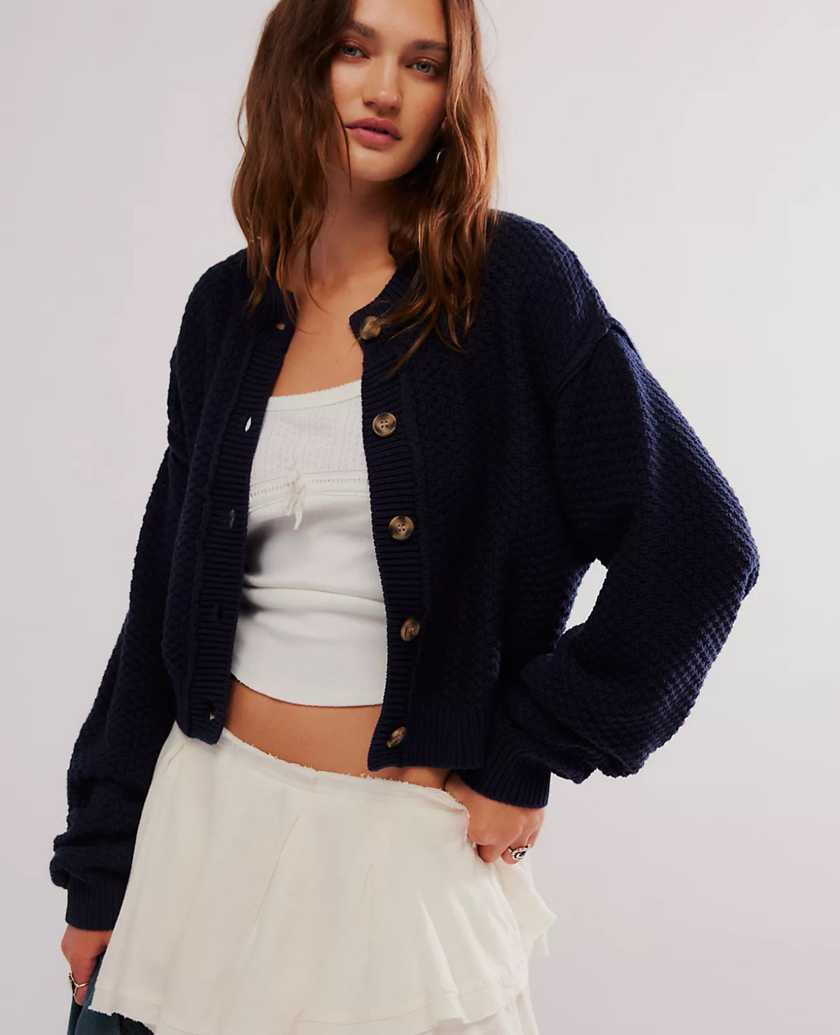 Designed to add dimension to any look, this cool and classic cardigan is featured in a staple button-front silhouette and textured knit fabrication for simple yet super special style from season to season.

Fit: Slouchy, relaxed fit
Features: Button-front closure, ribbed hems, dropped shoulders, defined seaming
Why We <3 It: Sure to be your favorite addition to your sweaters collection, this timeless cardi is the perfect piece to pair over a tank, tee, or simply 