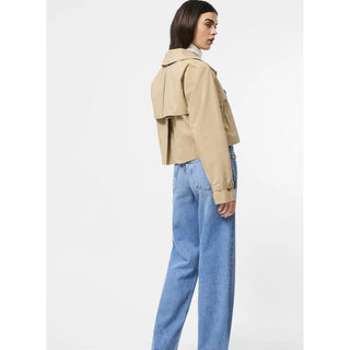 The Cropped Twill Trench is a modern twist on a timeless icon. With all the classic trench details—double-breasted buttons, a storm flap, structured shoulders—reimagined in a cropped silhouette, it’s the perfect top layer when you want something tailored but not too traditional.

Trench coat
Fabric: twill, structured, khaki
Double breasted button closure
Storm flap detail
Wide collar with V-neckline
Cropped
Our model is 5ft7.5" and wears a US Size 4
