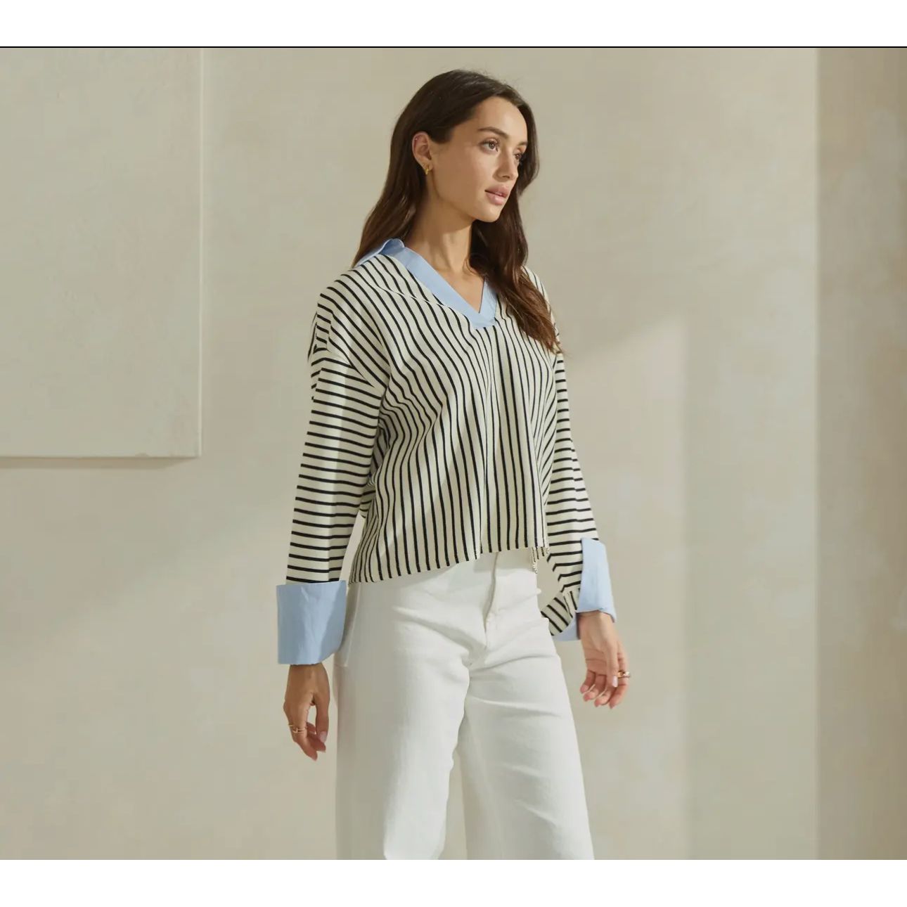 Shirt shown on model paired with white jeans