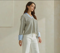Shirt shown on model paired with white jeans 