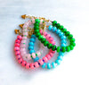 Gorgeous colorful stone candy jade is hand strung to create this beaded bracelet.  Layer these up or wear them alone, they are perfect for a stylish pop of color to your outfits! 
__________________
D E T A I L S

•Colorful jade strung by hand 
•18kt gold filled closure and heart charm
•Available in a 6.5 inch length with a 1.5 inch extender