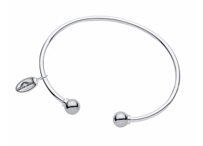 LeStage's genuine Cape Cod Bracelet, with its simple but stylish design is a favorite for all ages!

A unique spin on the classic look -- this cuff features two sterling silver or gold balls on each end.  This bracelet is great to wear alone or add to your Cape Cod Jewelry collection. 

Sterling Silver shown

Made in USA 