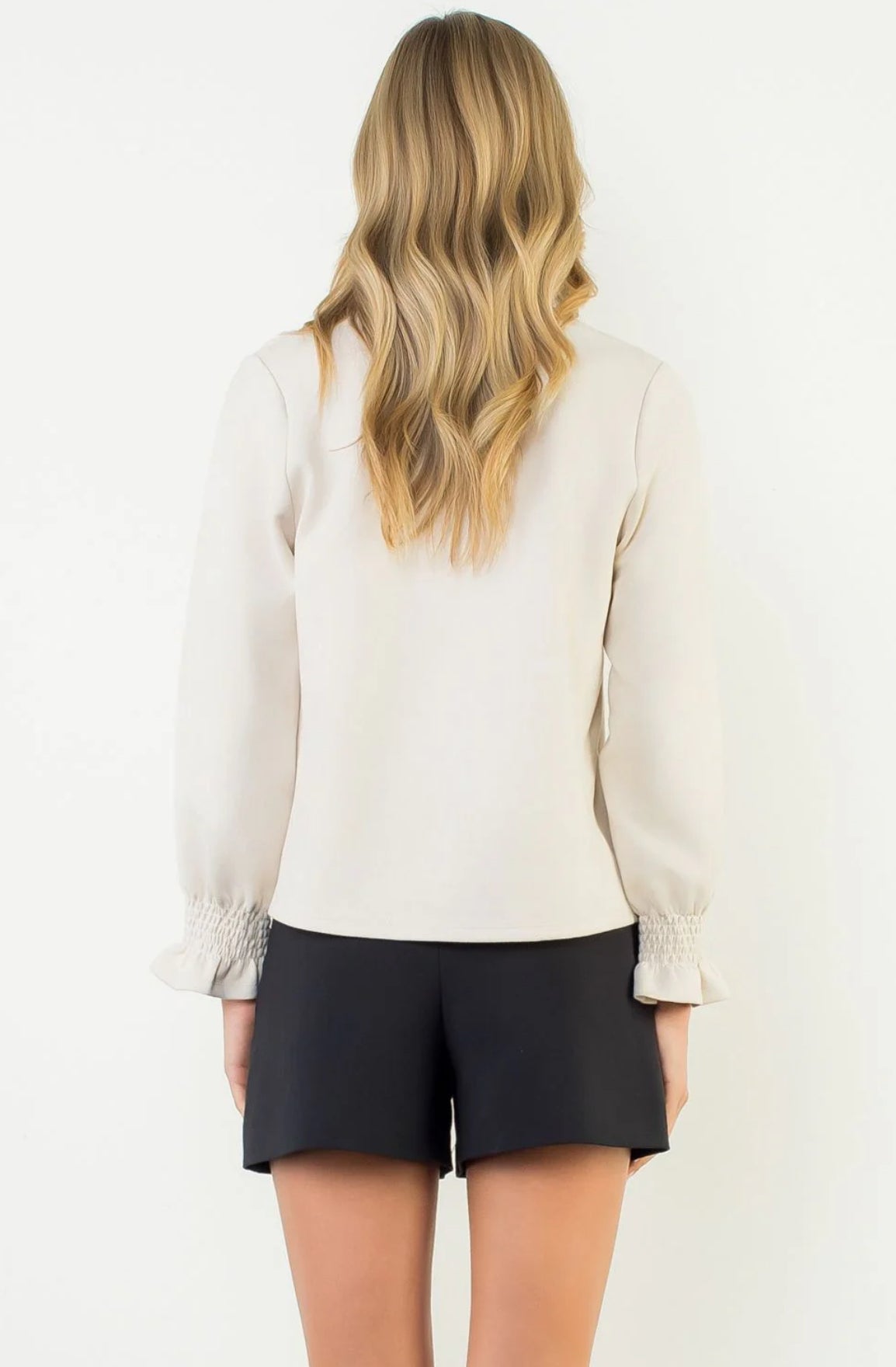 Shown from behind spotted with black 