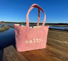 This top selling bag is perfect for days on the beach, boat or running errands.  

Durable cotton canvas bag imprinted with the words, "SALTY". Thick & cushioned 12" Shoulder length handles
Red shown