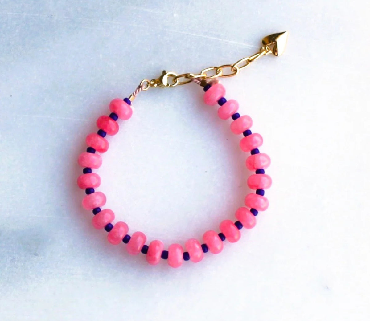 Bright pink and navy bracelet shown 