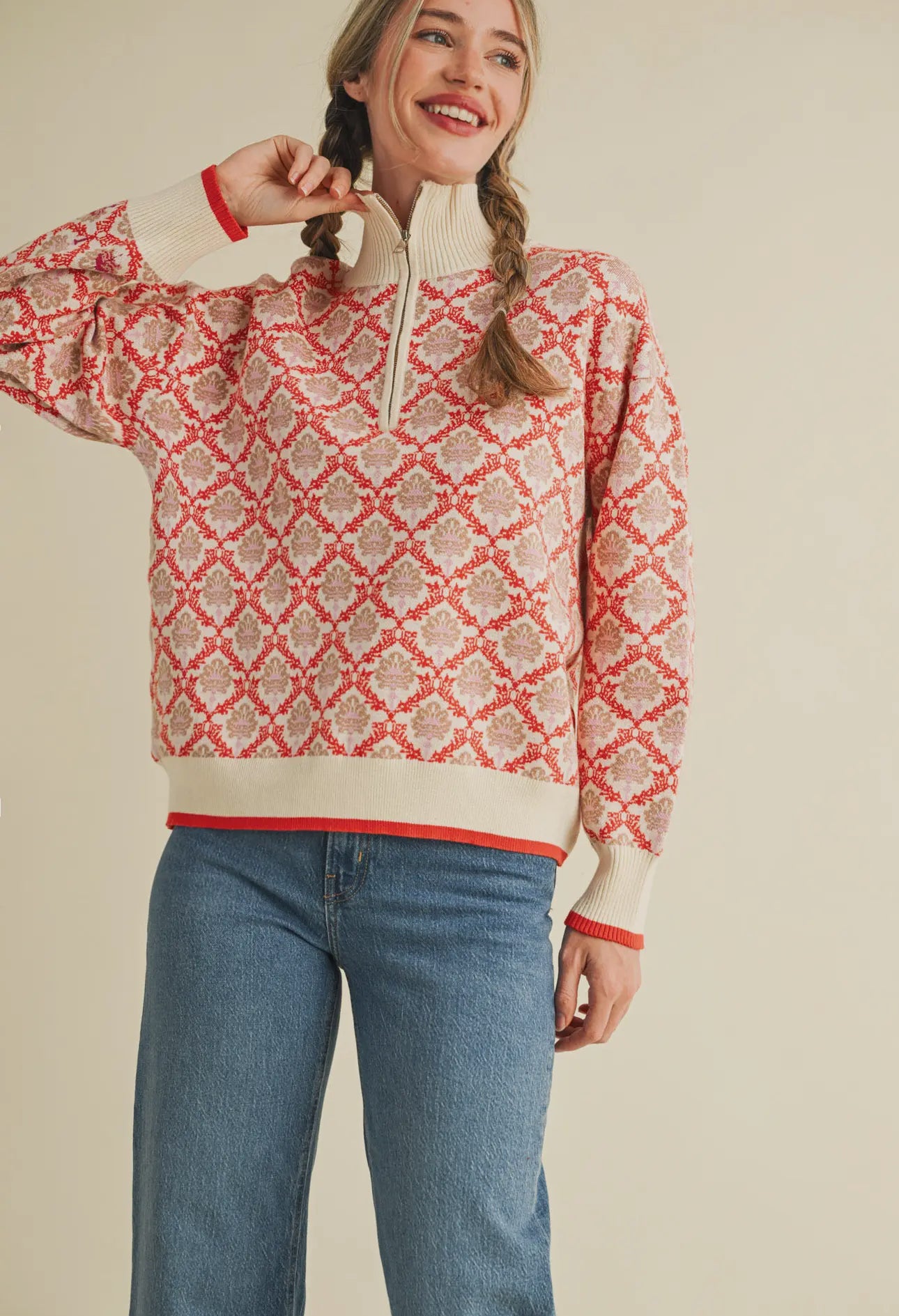 Cream bans on bottom, cuffs and collar trimmed in red 