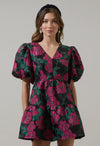 Add a touch of romance to your night with the Farrah Jacquard Floral May Tiered Mini Dress. Floral jacquard fabric shapes this dress with a v-neckline and bubble short sleeves. The open back has a tie string and zipper. Wear it with simple accessories and strappy heels for a finished look.

- Floral
- Jacquard
- V-neck
- Tiered mini 
