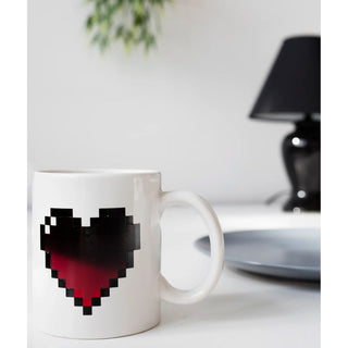 Fill Your heart mug with your favorite warm drink and watch the heart change from black to red. 


Reacts to heat, revealing new and fun graphics. Capacity: 11oz / 325ml

Design: KDT
Materials: ceramic, thermographic ink
Packaging: color box
Dimensions: 12 x 9,5 x 8 cm