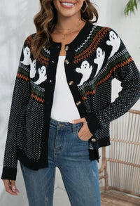 This adorable polka dot ghost cardigan is perfect for Halloween. 

White ghosts  around upper middle with black and white polka dots all over and white and orange lines above and below ghosts. 