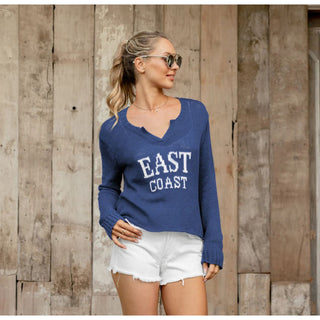 East Coast V Sweater – Cool, Cropped & Coastal blue with white lettering 

East Coast lovers, this one’s for you. The East Coast V by Wooden Ships is the ultimate warm-weather sweater, featuring bold knit-in lettering and a breezy, lightweight feel. Made with Wooden Ships’ signature cotton blend yarn, this cropped, boxy silhouette 