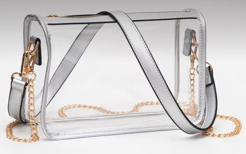 Showing silver table clear bag with silver strap or gold chain as an option 