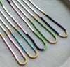 Bright, bold, and full of personality—these multicolor seed bead necklaces are made to stand out. With vivid green, turquoise, and deep navy tones, these handmade pieces bring a splash of joy to any outfit. Whether you're heading to a music festival, beach day, or brunch with friends, this design adds a playful pop of color that totally vibes.
 
Details:
•Vibrant green, lilac, turquoise, and navy seed beads
•Lightweight and comfortable
•Gold filled spring ring clasp 
 
Each piece is handmade, giving it a o