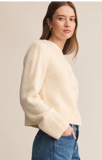 Shown from side on model wearing jeans 