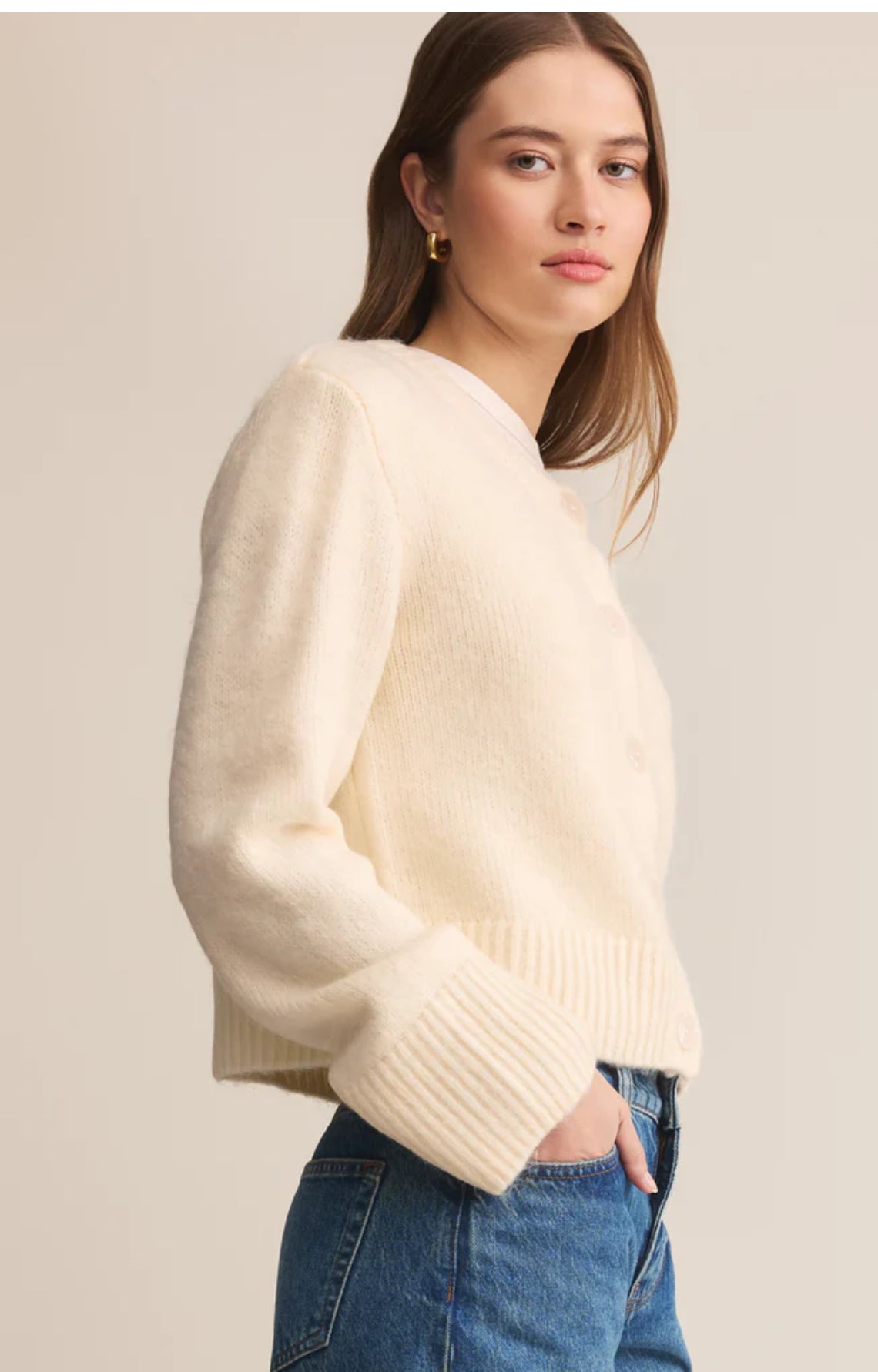 Shown from side on model wearing jeans 