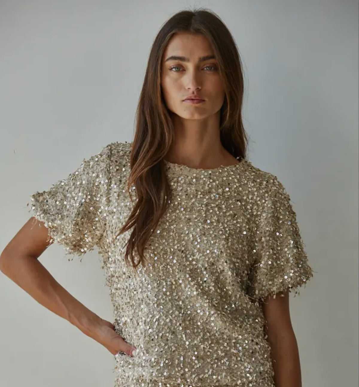 This top is a show stopper. Wear it with your favorite pair of denim, leather pants or a pencil skirt and you are ready to celebrate. 


 